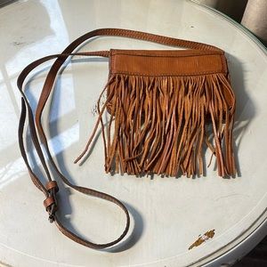 Brown ‘Patricia Nash’ crossbody bag with adjustable strap.